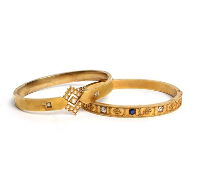 Lot 199 - An Edwardian 15ct gold hinged bangle, set with...