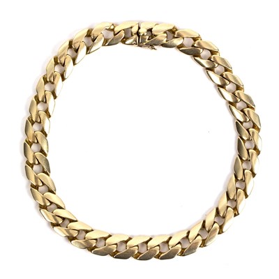 Lot 204 - An 18ct gold Cartier bracelet of flattened...