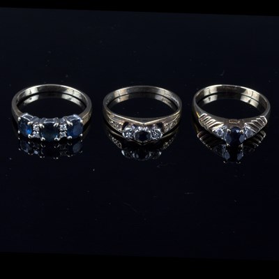 Lot 223 - A sapphire and diamond dress ring, the three...