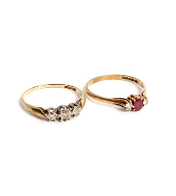 Lot 251 - A ruby and diamond three-stone ring set in 9ct...