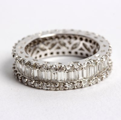 Lot 253 - A diamond eternity ring with central row of...