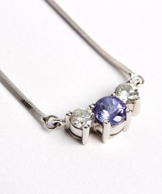 Lot 258 - A diamond and tanzanite pendant, set with a...