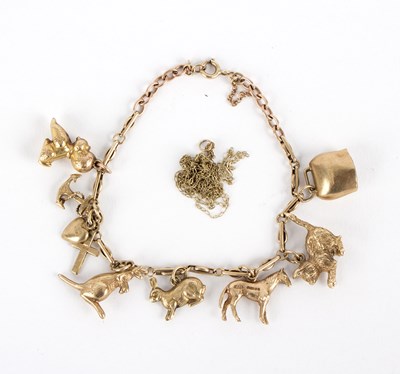 Lot 277 - A gold charm bracelet, hung with mainly 9ct...