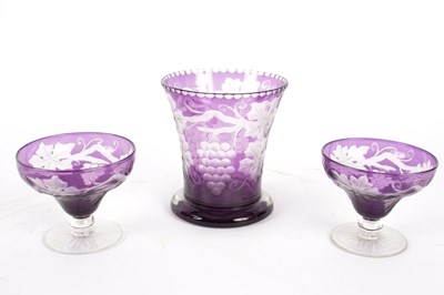 Lot 293 - A Bohemian amethyst glass vase, etched with...