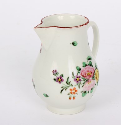 Lot 339 - A Bristol milk jug painted with flowers, 9cm high