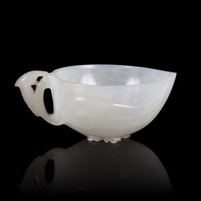 Lot 361 - A white jade peach cup, 19th Century, carved...