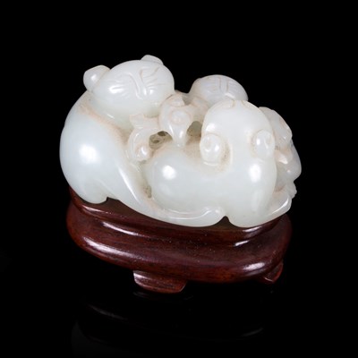 Lot 363 - A pale celadon jade figure of three kittens...