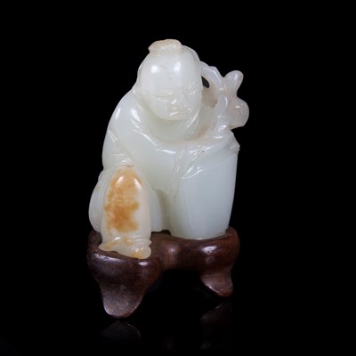 Lot 368 - A pale celadon jade figure of a kneeling boy...