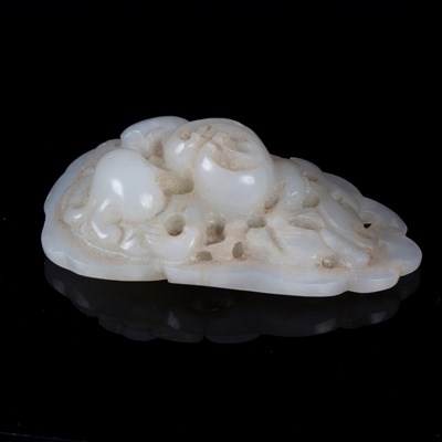 Lot 369 - A pale celadon jade leaf with pierced fruits,...