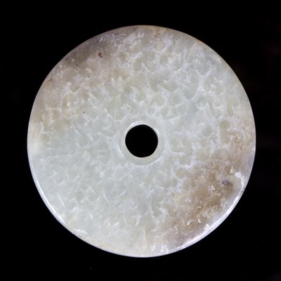 Lot 376 - A white jade bi-disc carved with clouds, 19th...