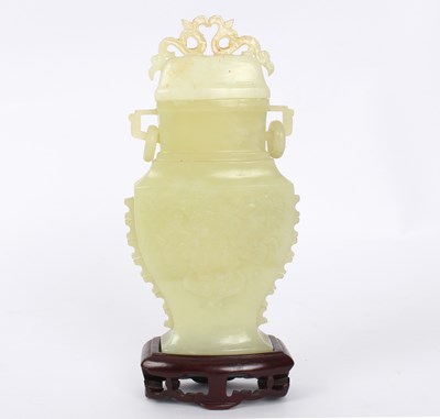 Lot 380 - A jadeite vase and cover decorated flowers in...