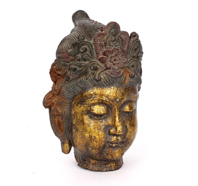 Lot 400 - A cast iron head of Guanyin, with flower...