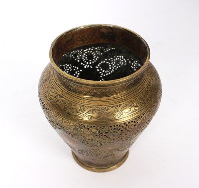 Lot 403 - A Persian brass vase with reticulated pierced...