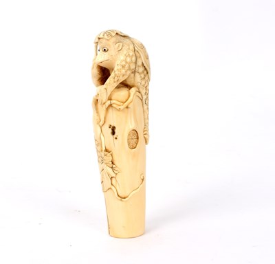 Lot 437 - A Japanese carved ivory parasol handle, Meiji...