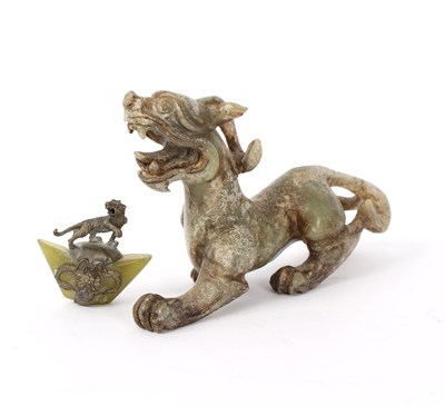 Lot 439 - A Chinese nephrite carving of a prowling...