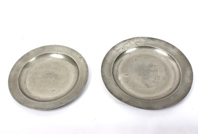 Lot 465 - An 18th Century pewter charger with plain...