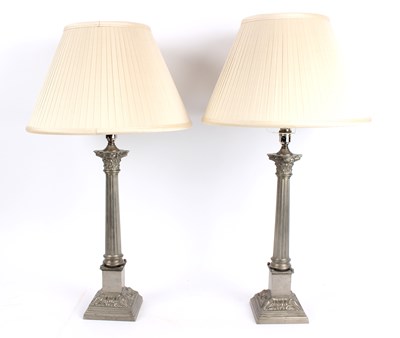 Lot 490 - A pair of pewter lamps of Corinthian column...