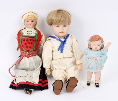 Lot 514 - Two Continental porcelain and bisque dolls and...