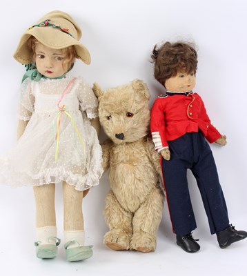 Lot 516 - Two cloth dolls and a teddy bear