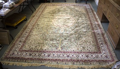 Lot 730 - A modern silk rug decorated oval scalloped...