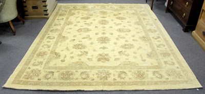 Lot 731 - A modern Persian rug decorated floral designs...