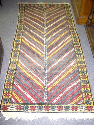 Lot 733 - A Gendje rug with central zigzag field within...