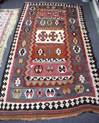 Lot 741 - A kilim rug decorated with geometric designs,...