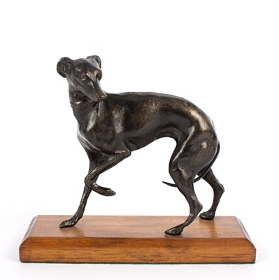 Lot 760 - A bronzed metal whippet, after P J Mene,...