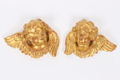 Lot 761 - A pair of gilt plaster cherub mask wall...