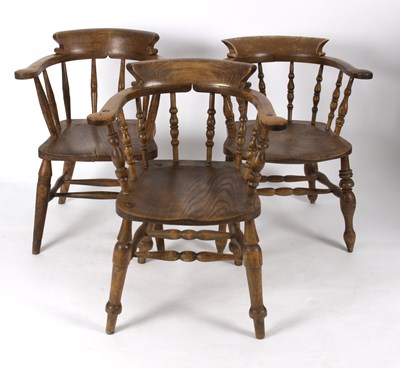 Lot 803 - Three elbow chairs with dished elm seats