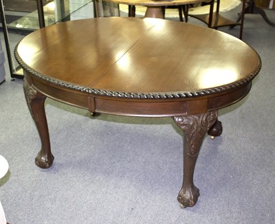 Lot 804 - A mahogany D-end dining table on claw and ball...