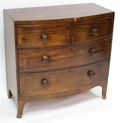 Lot 813 - A Regency bowfront chest of two short over two...