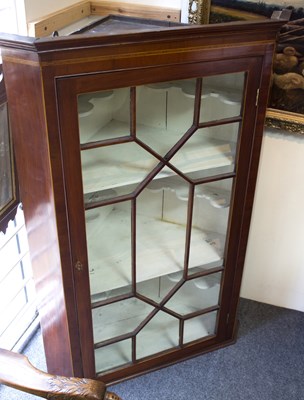 Lot 818 - An early 19th Century mahogany corner cupboard,...