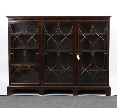 Lot 826 - An Edwardian mahogany bookcase, fitted...