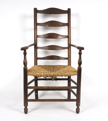 Lot 836 - An ash ladderback armchair with rush seat