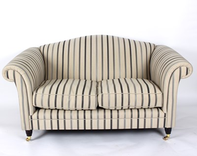 Lot 840 - A modern Laura Ashley two-seater sofa with...