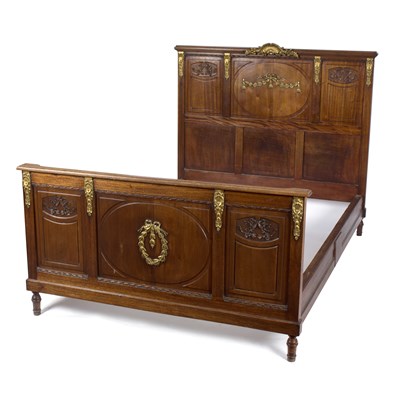 Lot 850 - A French walnut and ormolu mounted 5ft bed,...