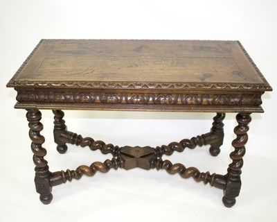 Lot 862 - A late 19th Century carved oak table, fitted a...