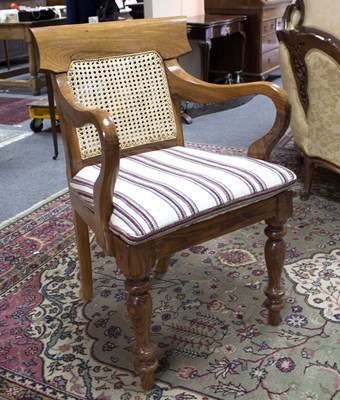 Lot 873 - An Anglo-Indian open armchair with caned back...