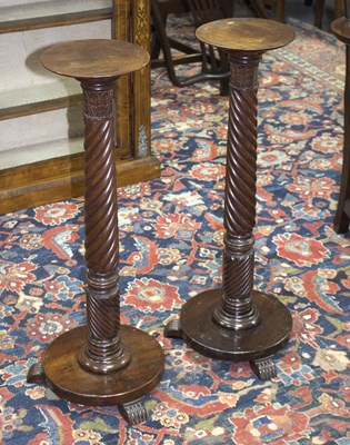 Lot 875 - A pair of Regency mahogany torcheres, each...