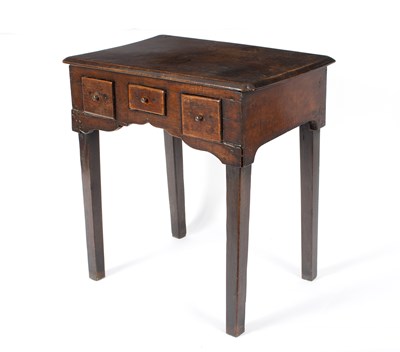 Lot 886 - A fruitwood table fitted three drawers on...