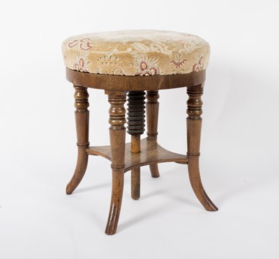 Lot 888 - A circular piano stool, with adjustable top on...