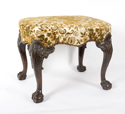 Lot 891 - An upholstered stool on carved cabriole legs...