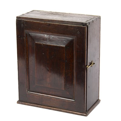 Lot 895 - An early 18th Century oak spice cupboard...