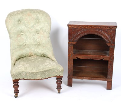 Lot 932 - A Victorian button back chair on turned legs...