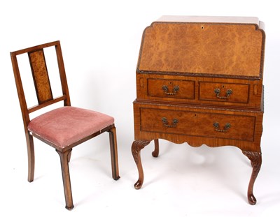 Lot 942 - A figured walnut bureau on cabriole legs...