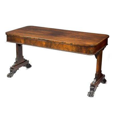 Lot 950 - A Regency rosewood library table, on paw feet,...