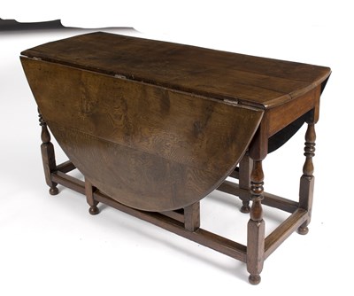 Lot 953 - An oak gateleg table, the oval two-flap on...