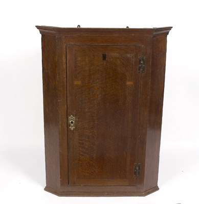 Lot 955 - A George III oak corner cupboard, 101.5cm high