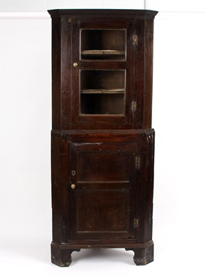 Lot 956 - An 18th Century Welsh oak corner cupboard,...